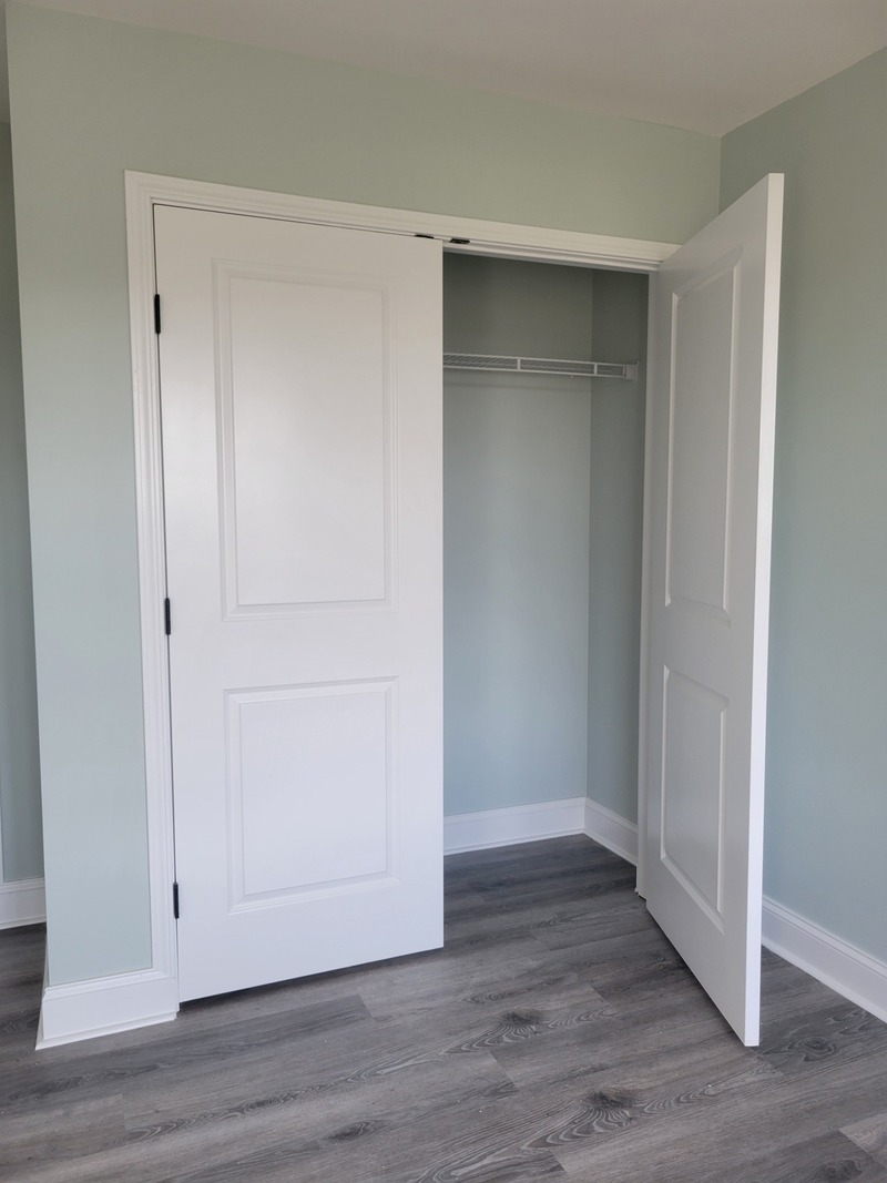 A freshly updated closet featuring newly painted walls and doors for a clean, smooth, and modern finish. The project included full surface preparation, precise cutting lines, and a uniform application that brightens the room and enhances the overall space